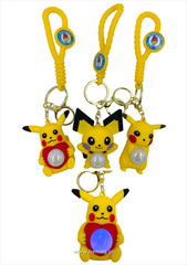 Brelok gumowy duży żółty stworek świecący z opaską 12szt w paczce